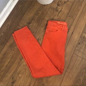 Madewell “skinny skinny ankle” jeans (orange)